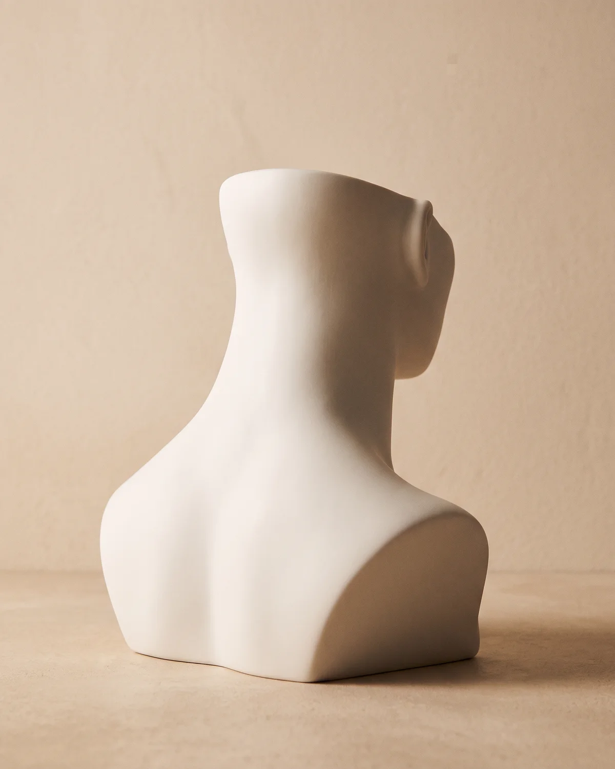 The neck area shown on a ceramic figure