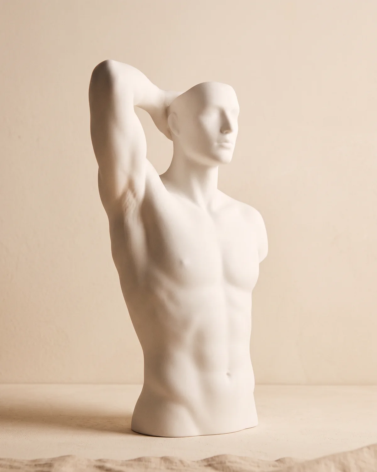 The under arms area shown on a ceramic figure