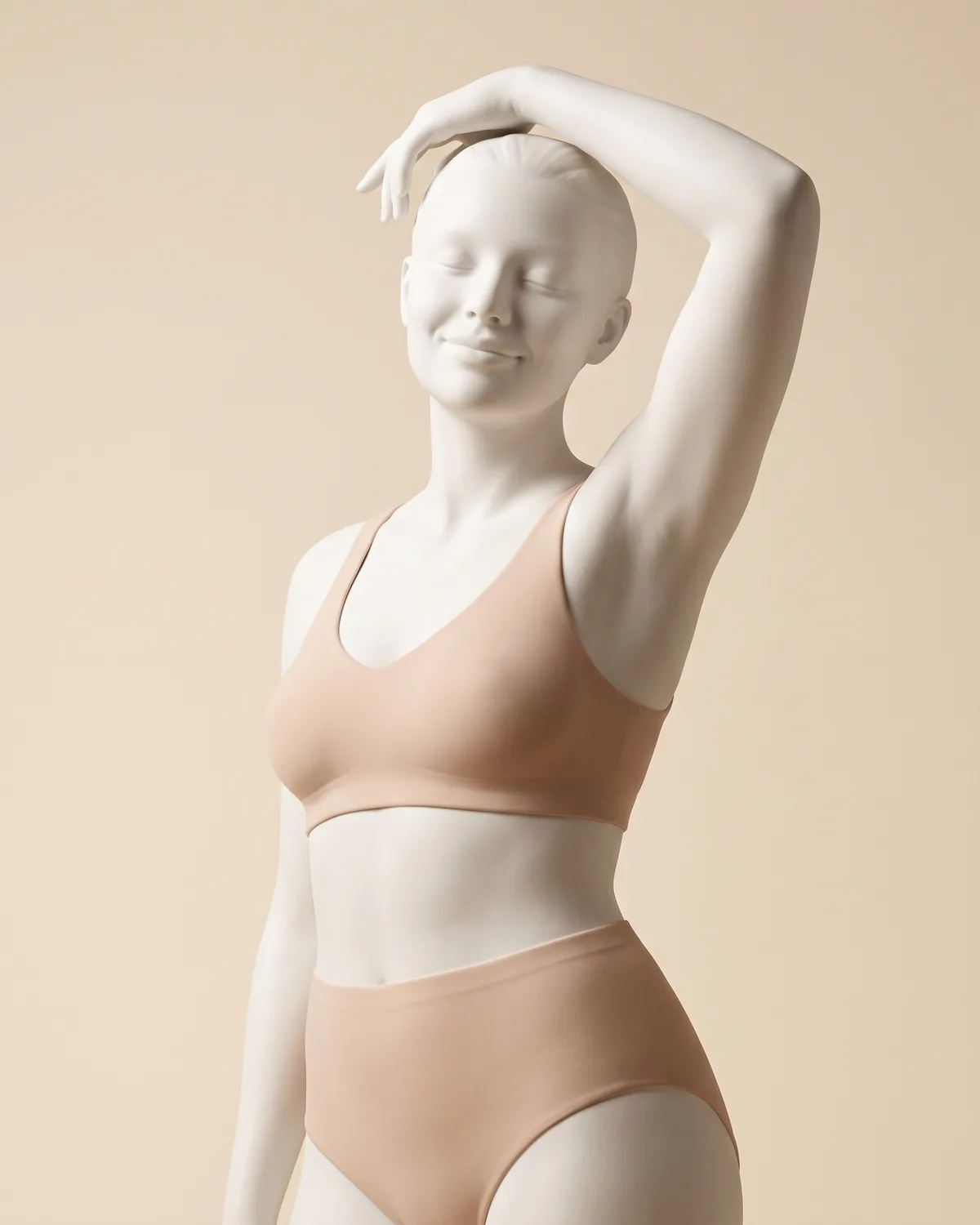 A ceramic figure from the head to the hips, one arm raised